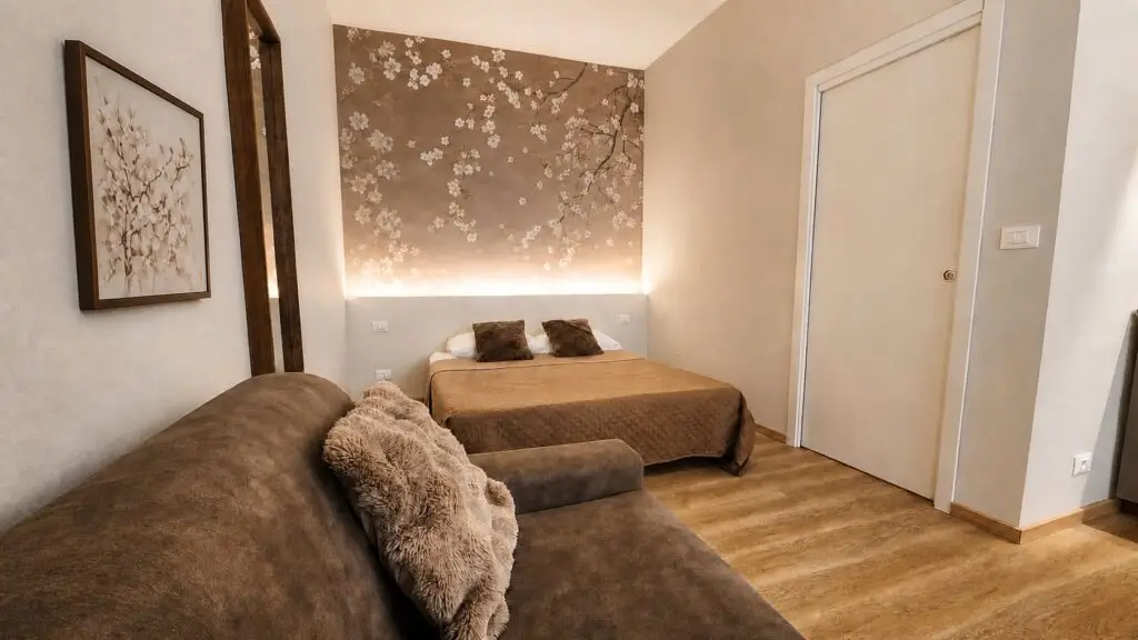 Lit double et canapé-lit de la Room 1 chez Gaia Suites Turin
