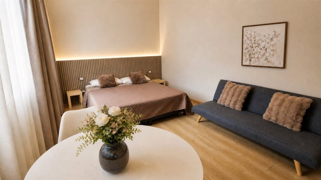Room 2 chez Gaia Suites à Turin avec lit double et espace détente